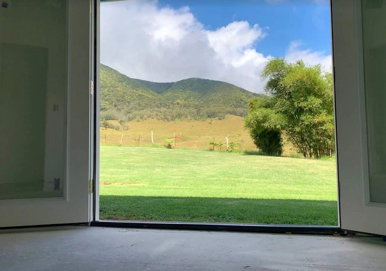 view from French doors to a tranquil mountainside in Hawai'i view from French doors to a tranquil mountainside in Hawai'i